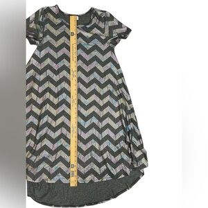 fitted bodice Circle hi low skirt Short sleeve Has shimmer Scoop neck Geometric
